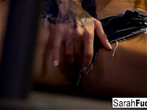 Sara Jessie milks in a prison cage